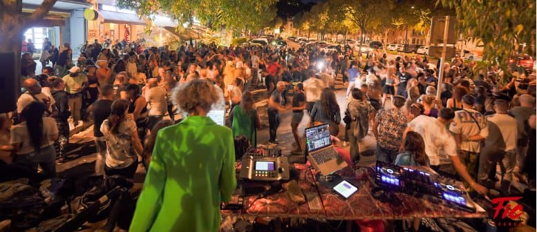 Open-air before party, crowd dancing at night