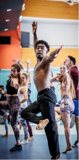 Teacher leading a group dance class