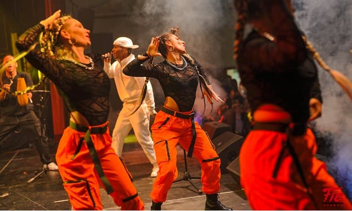 Dance show in orange costumes