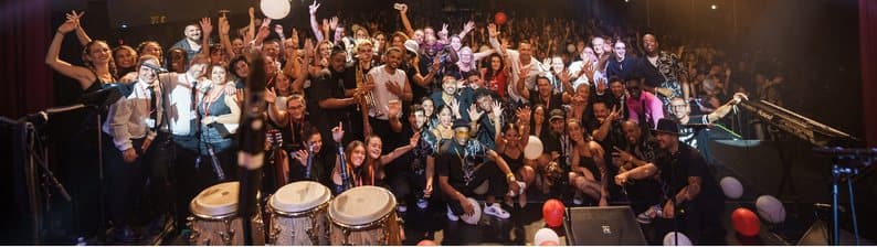 The festival's volunteer team gathered on stage